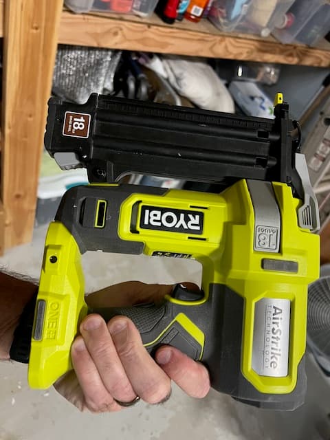 Side photo of the Ryobi nailer showing brand, model, and condition